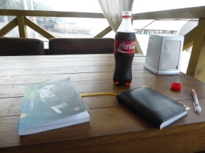 Diary, Coca Cola and a collection of Galaktion Tabidze's poems at a beachside bar.