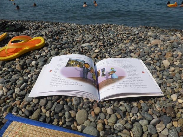 Reading about Pirosmani on the beach in Gerogian