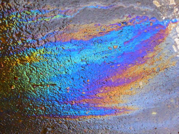 ROYGBIV the rainbow hues of oil on wet tarmac